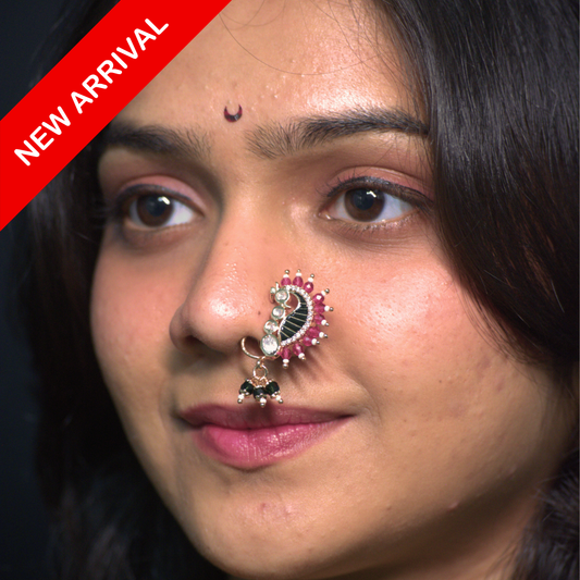 Nath Soyara Classic
Maharashtrian bridal nath
Peacock motif nath
Crescent-shaped nose ring
Polki-style nath
Green enamel nath
Ruby and magenta bead nath
Traditional Maharashtrian jewelry
Festive bridal nose ring
Designer ethnic nath