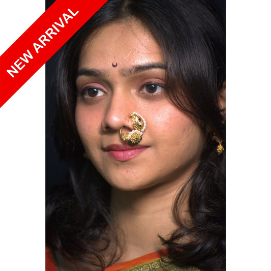 Nath Janika Eternal
Maharashtrian bridal nath
Ruby and green stone nath
Pearl embellished nose ring
Gold plated traditional nath
Festive bridal nath
Designer Maharashtrian jewelry
Teardrop motif nath
Wedding nose ring
Ethnic bridal nath