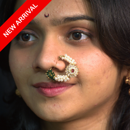 Nath Saibai Aura
Maharashtrian pearl nath
Ruby and pearl nose ring
Traditional Indian nath
Festive nose jewelry
Designer Maharashtrian nath
Lightweight bridal nath
Green and ruby accent nath
Elegant ethnic nose ring
Handcrafted Maharashtrian nath