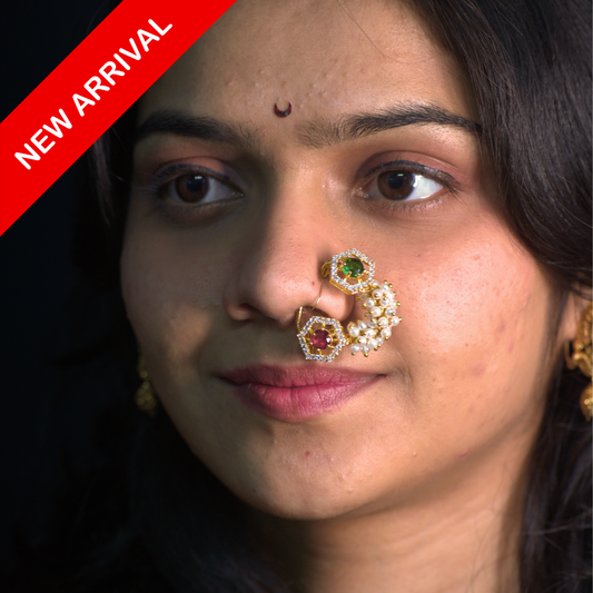 Nath Sakhika Blossom
Emerald and ruby nath
Hexagonal motif Maharashtrian nath
Pearl cluster nose ring
Traditional gold nath
Festive Maharashtrian jewelry
Lightweight bridal nath
Designer ethnic nose ring
Daily wear nath
Elegant pearl and stone nath
